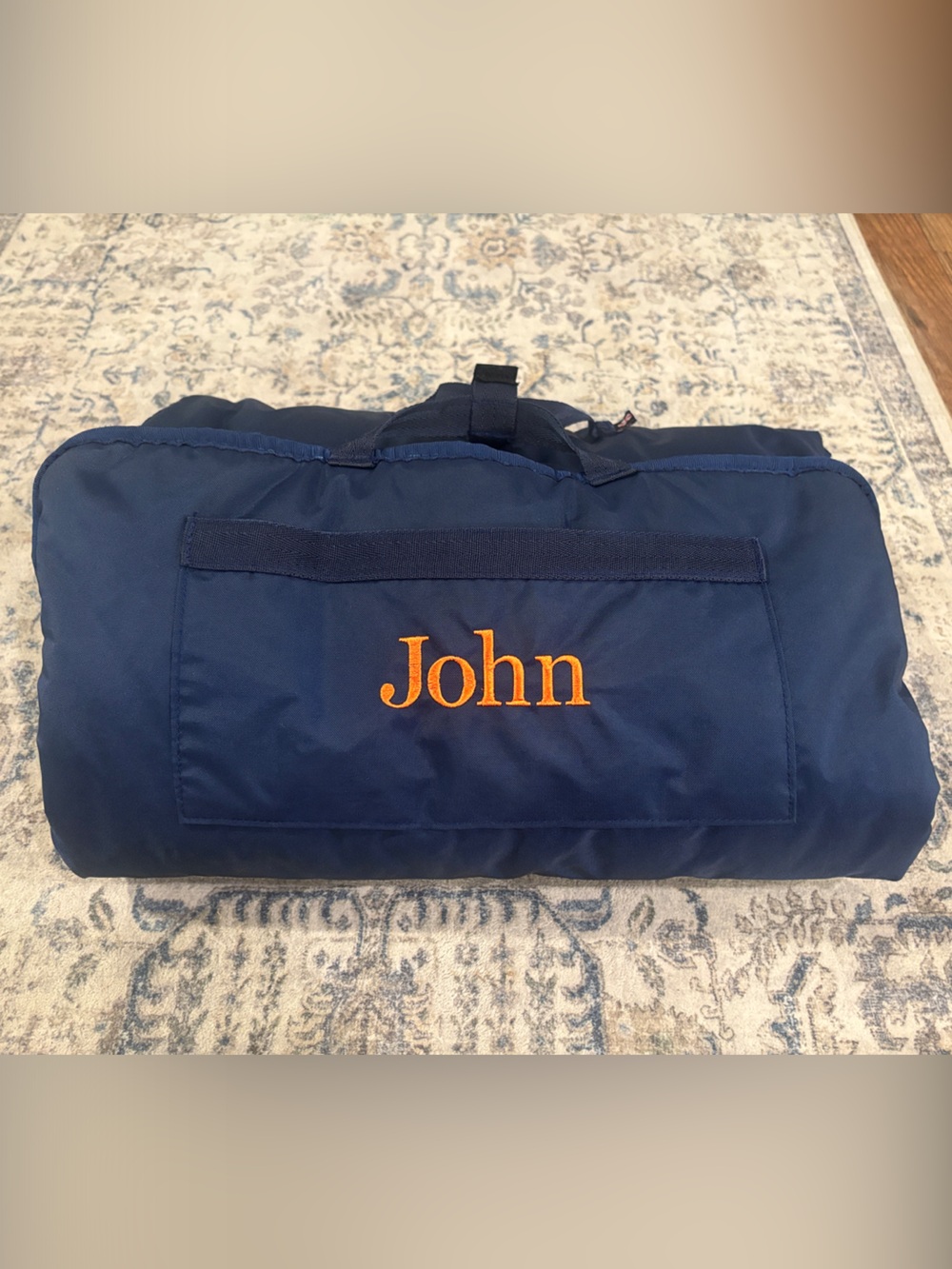 Custom child’s nap roll with orange embroidered name John
